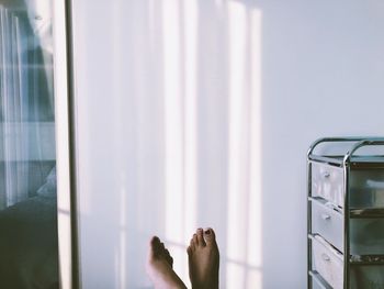 Low section of woman at home