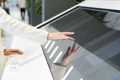Businesswoman using touch screen device at office