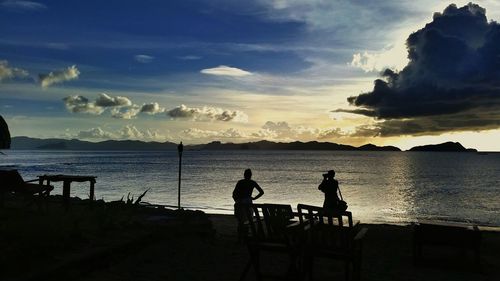 Silhouette of people in water