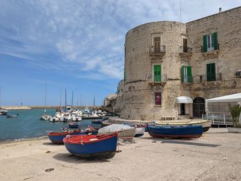 Boats in sea against sky