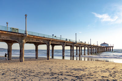 Bridge over sea against sky