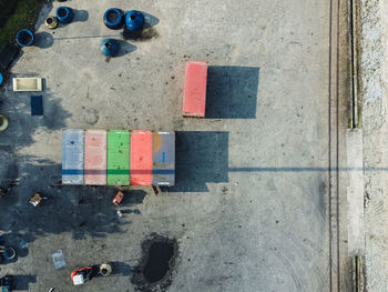 High angle view of multi colored containers 