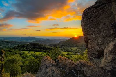 Scenic view of landscape against sky during sunset