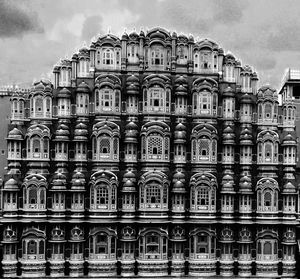 Low angle view of building against cloudy sky