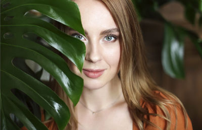 Close-up portrait of smiling young woman