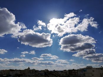 Panoramic view of city against blue sky