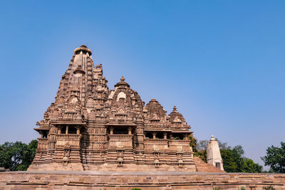 Low angle view of historical building against blue sky