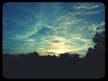 Scenic view of landscape against sky at sunset