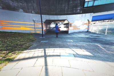 Woman walking on road