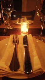 Close-up of wine glasses on table in restaurant