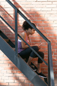 High angle view of young woman on steps