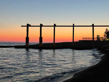 Scenic view of sea against clear sky during sunset