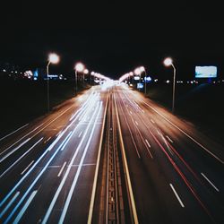 High angle view of light trails on road at night