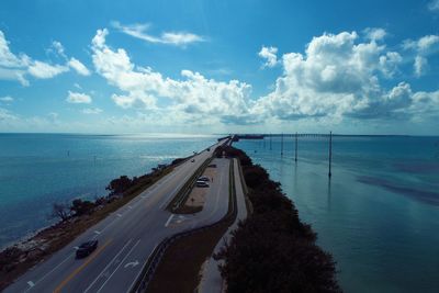 High angle view of road by sea against sky