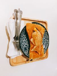 High angle view of food on table against white background