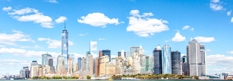 Skyscrapers against cloudy sky