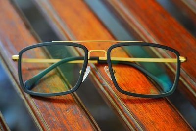 High angle view of sunglasses with reflection on glass