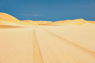 Car tracks in the namibian desert outside swakopmund.