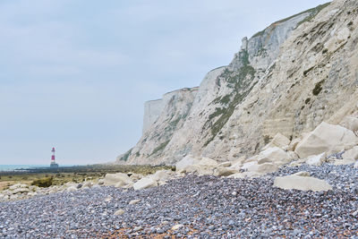 Beachy head lighthouse, seven sisters chalk cliffs at low tide near eastbourne, east sussex,