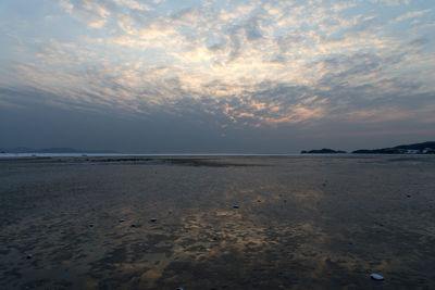 Scenic view of sea against sky at sunset