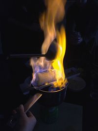 Cropped image of hands preparing feuerzangenbowle