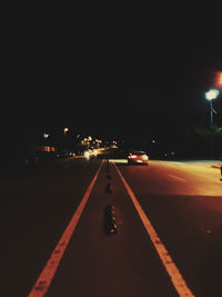 Cars on road at night