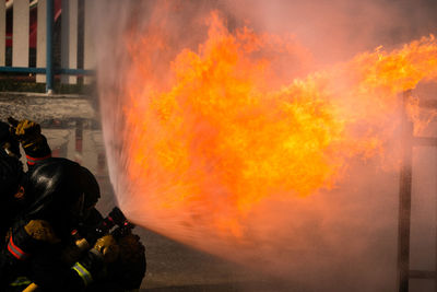 Low angle view of fire against orange sky