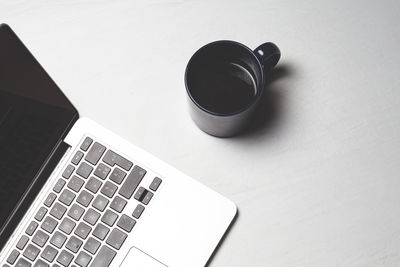 High angle view of coffee cup on table