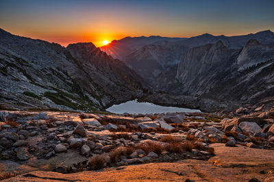 Scenic view of mountains against sky at sunset