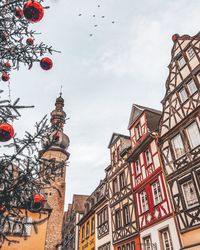 Low angle view of church and buildings against sky