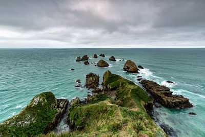 Nugget point is located in south island, new zealand 