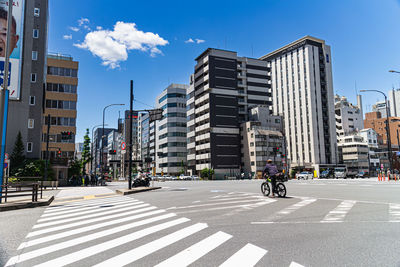 Buildings in city against sky in tokyo, japan