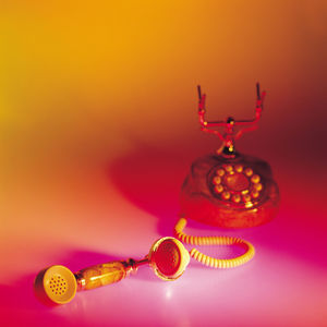 Close up of rotary phone on colored background