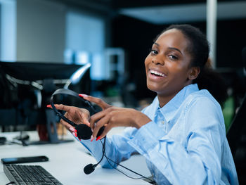 Portrait of young woman using mobile phone