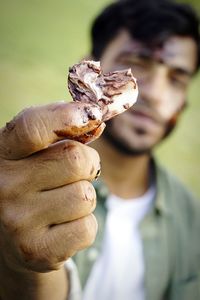 Close-up of hand holding ice cream