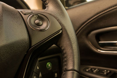 Close-up of steering wheel in car