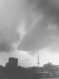 Low angle view of building against cloudy sky