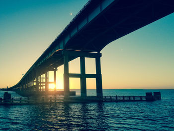 View of bridge over sea against clear sky