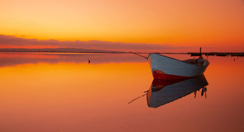 Boat in the water. fishing boat in the calm waters of the pond  santa caterina in southern sardinia