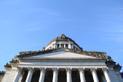 Low angle view of building against blue sky