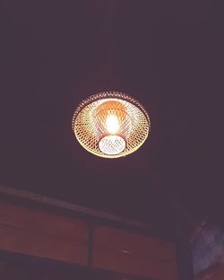 Low angle view of illuminated pendant light