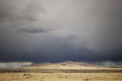 Scenic view of landscape against cloudy sky