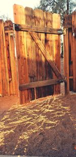 Old wooden posts on wall of house