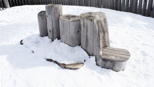 Wooden seating in the snow