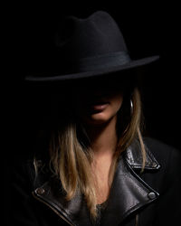 Close-up portrait of a woman wearing hat