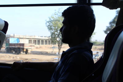 Portrait of man in car