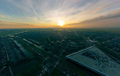 Aerial view of cityscape against sky during sunset. purmerend weidevenne