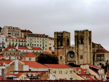 Buildings in city against sky