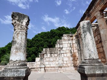 Low angle view of old ruins against sky