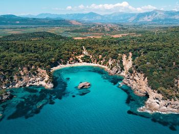 High angle view of land and sea against sky